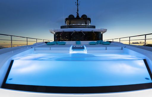Deck Jacuzzi onboard boat charter SANCTUARY lit at dusk