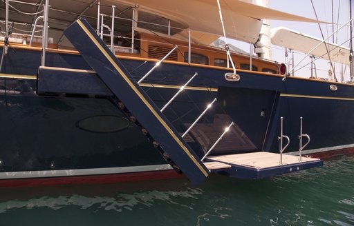 retractable staircase provides entry onto luxury yacht ATHOS 