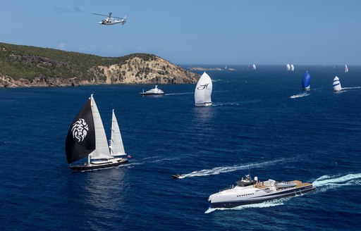 support vessel 'Fast & Furious' cruises alongside sailing yachts
