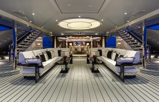 seating area on main deck aft of motor yacht OKTO 