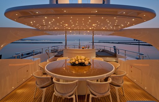 radar arch lights up over dining area on the sundeck of luxury yacht AZIZA 