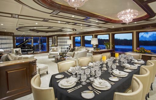 new dining table and chairs in main salon of motor yacht Bacchus