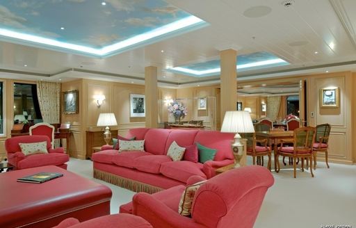 main salon with red sofas on board expedition yacht ‘Northern Star’ 