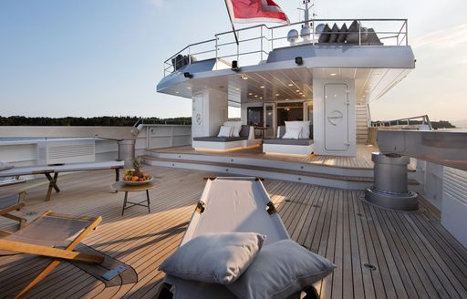 sun loungers and chairs set up on the aft deck of motor yacht siempre