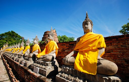 Buddhas lined up in a row in Thailand