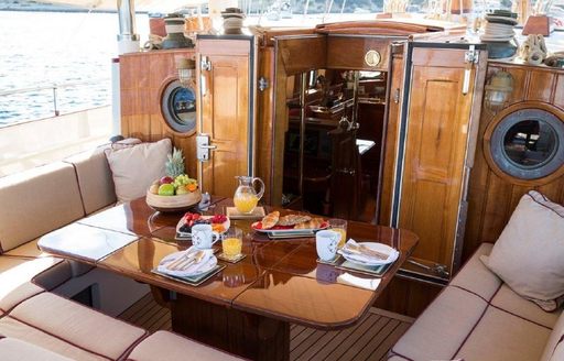 Alfresco dining table set for lunch on board charter yacht Silver Stream