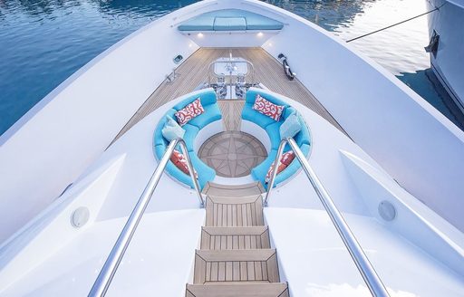 steps leading down to built-in seating on foredeck of luxury yacht SERENGETI