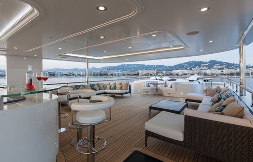 bar, lounging and sunning areas on sundeck of superyacht PRIDE