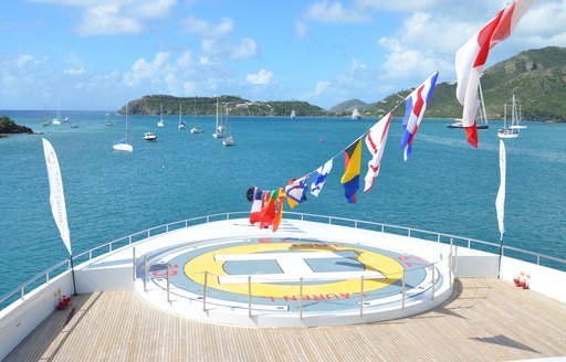 touch and go helipad decorated with bunting on board motor yacht Lauren L 