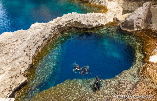 Scuba diving in the warm Maltese waters