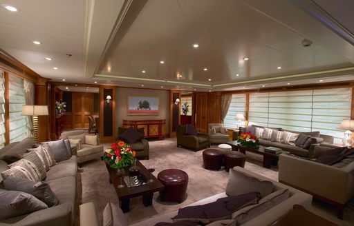 Main salon of charter yacht UTOPIA, with plenty of seating areas