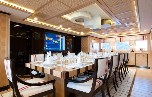 Dining area onboard charter yacht AXIOMA