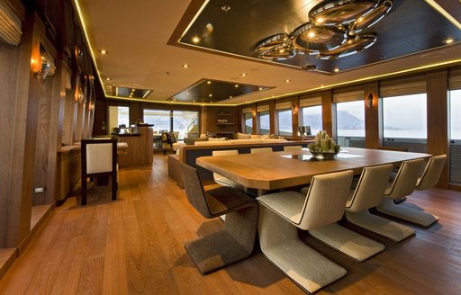 Dining table and chairs on board superyacht VANTAGE