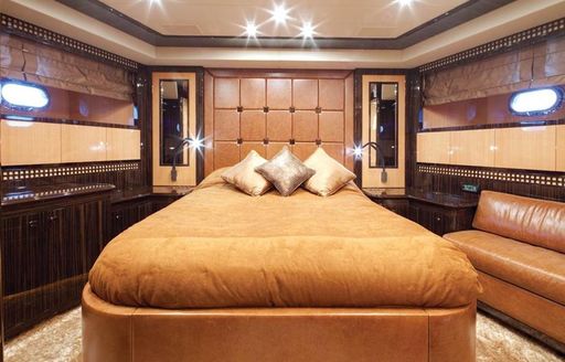 Luxury yacht Orion 1 cabin with bed and bright lighting