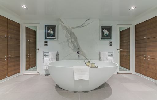 Marble walls and freestanding bath on board luxury yacht Big Sky