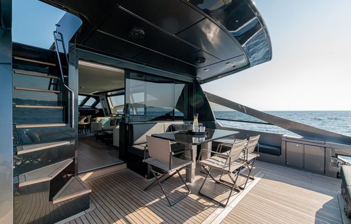 Aft deck onboard charter yacht SOPHIA, with a small dining table