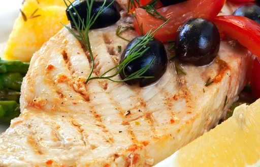 Grilled swordfish served Greek style