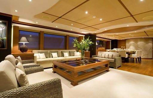 salon of superyacht Sirocco with sofas around glass coffee table