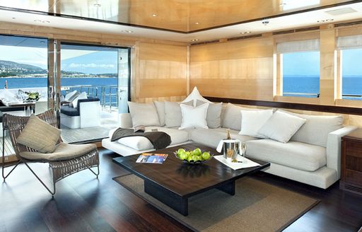 Interiors of motor yacht Christina G, with white sofa and light coloured walls