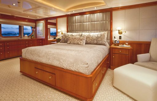 full-beam master suite with cherrywood panelling on board motor yacht Milk and Honey 