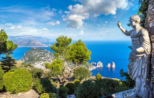 statue on the island of capri overlooking the blue sea