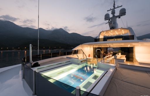 swimming pool on sundeck of motor yacht IRIMARI at dusk