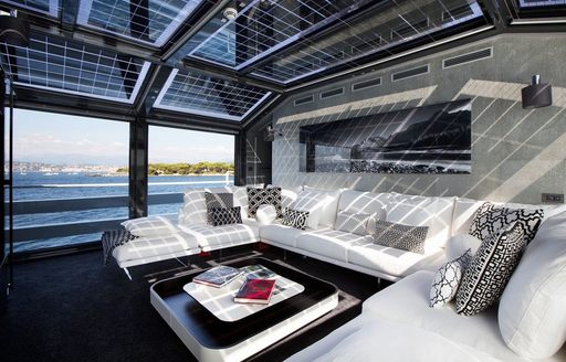 monochrome skylounge with huge windows aboard luxury yacht JURATA 