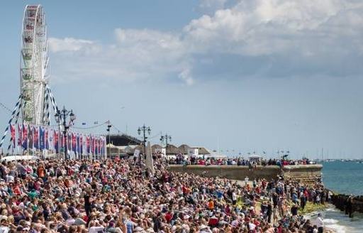 spectators line up on the coast of Portsmouth for America's Cup World Series event