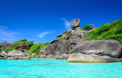 blue waters and rocky coastline of Similan Islands in Thai waters