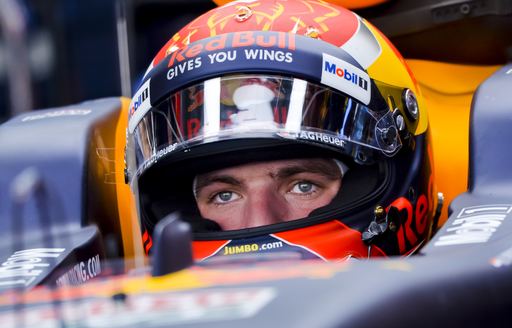 F1 driver wearing helmet in his car at the Monaco Grand Prix