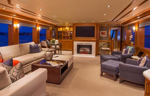 skylounge with fireplace on board motor yacht Far Niente