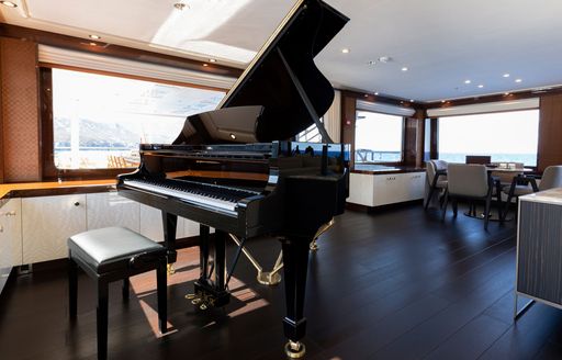 grand piano onboard charter yacht Galene