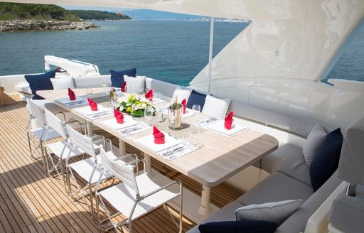 table set for dinner on the flybridge of motor yacht Porthos Sans Abri 