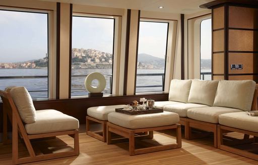 seating area backed by large windows on board superyacht GLADIATOR 