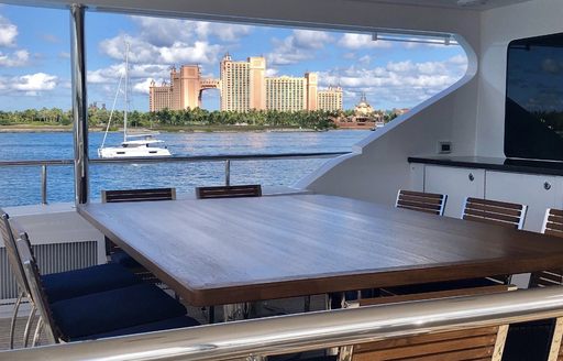 al fresco dining with TV on aft deck of charter yacht TANZANITE 