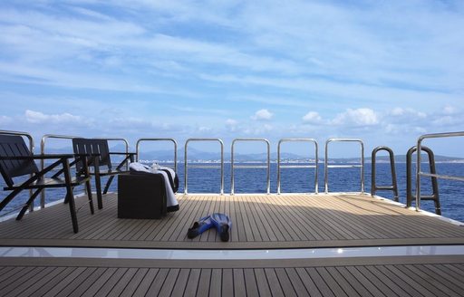 fold-down swim platform with two deck chairs aboard luxury yacht ‘Hurricane Run’ 