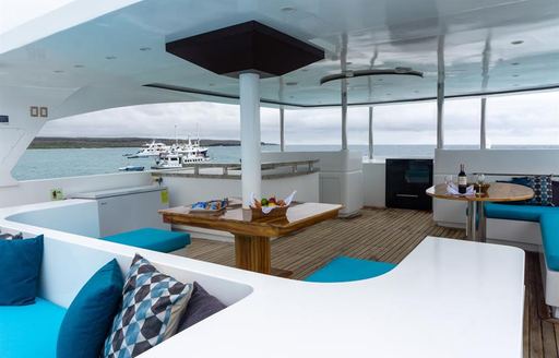 Covered seating area on motor yacht Grand Daphne