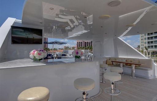 Sun deck with bar aboard luxury yacht AQUASITION