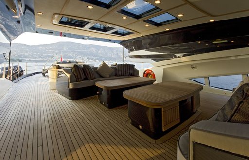 Superyacht VANTAGE flybridge with dining and seating areas