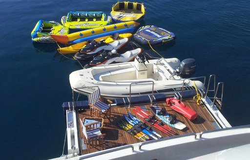 water toys lined up on swim platform of luxury yacht LADYSHIP 