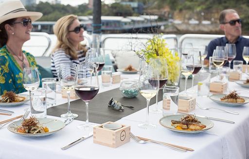 charter guests enjoy alfresco dining on charter yacht 'Ghost II'