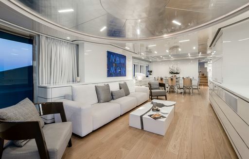 sofa and armchairs in the main salon of motor yacht DESTINY