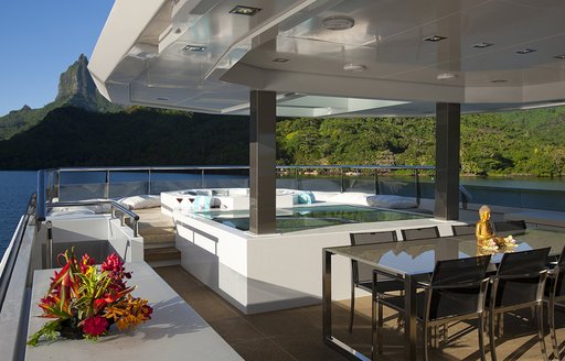 Jacuzzi, alfresco dining table and skylight aboard expedition yacht Big Fish 
