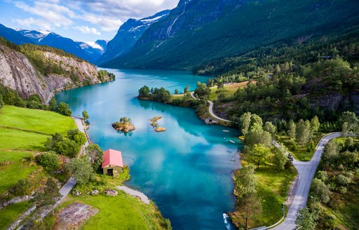 Houses by the water in Norway, alongside fjord