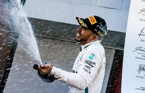Lewis Hamilton spraying champagne
