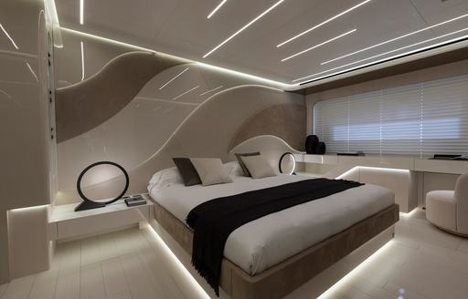 Double guest cabin onboard charter yacht N1, central berth facing forward with wide window and blind drawn adjacent