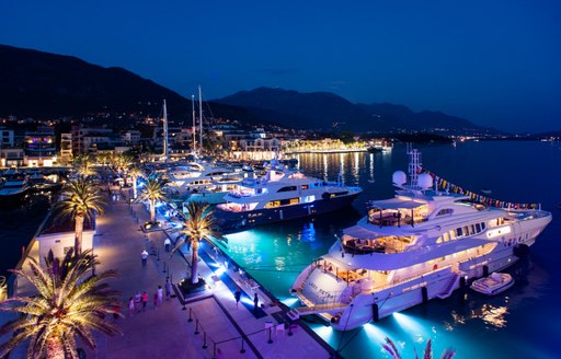 superyachts light up Porto Montenegro at night
