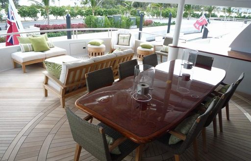 dining table and seating area main deck aft on superyacht claire