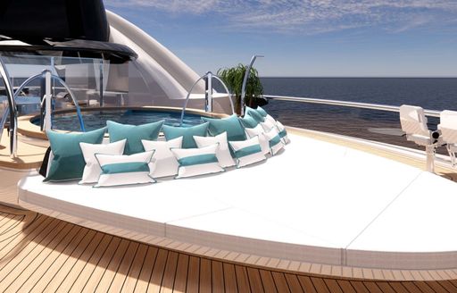 Large sunpad onboard charter yacht KISMET with teal cushions