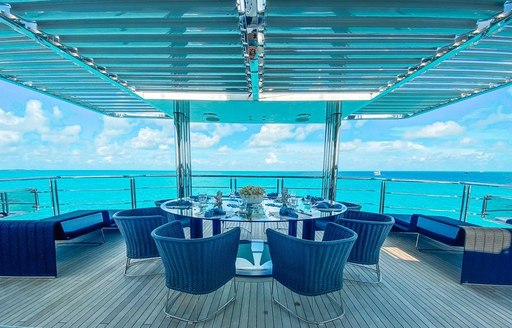 Open air dining space on superyacht OCULUS